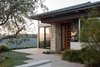Modern home with Exterior, Stucco Siding Material, Metal Roof Material, House, and Hipped RoofLine. Modern entry Photo of New Perspective