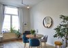 Modern home with Dining Room, Table, Light Hardwood Floor, Lamps, Ceiling Lighting, Floor Lighting, Stools, and Chair. After: dining area Photo 3 of Young and Fresh Apartment Renovation - Brussels