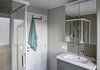 Modern home with Bath Room, Enclosed Shower, Drop In Sink, Ceramic Tile Wall, Corner Shower, and Ceiling Lighting. After: bathroom Photo 11 of Young and Fresh Apartment Renovation - Brussels