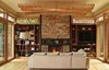 Modern home with Living Room, Chair, Sofa, Coffee Tables, Ceiling Lighting, Standard Layout Fireplace, Light Hardwood Floor, and Wood Burning Fireplace. Living space with Montana Ledgestone and steel fireplace Photo 6 of DESCHUTES House