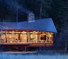 Modern home with Exterior, Shed RoofLine, House, Wood Siding Material, Metal Roof Material, and Cabin Building Type. Exterior view showing warped roof plane over living space Photo of Mazama House