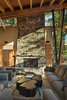 Modern home with Living Room, Standard Layout Fireplace, Coffee Tables, Chair, End Tables, Sofa, Ceiling Lighting, and Concrete Floor. Living space with custom soft leather coffee table Photo 7 of Mazama House