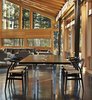 Modern home with Dining Room, Chair, Table, Ceiling Lighting, Standard Layout Fireplace, and Concrete Floor. Dining space with custom walnut and aluminum table Photo 9 of Mazama House
