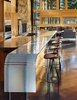 Modern home with Kitchen, Glass Tile Backsplashe, Refrigerator, Cooktops, Wood Cabinet, Wall Oven, Concrete Floor, Engineered Quartz Counter, Ceiling Lighting, and Undermount Sink. Curved cast glass counter at kitchen with custom stools Photo 10 of Mazama House