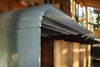Modern home with Kitchen, Concrete Floor, Wood Cabinet, Wall Oven, Refrigerator, Undermount Sink, Glass Tile Backsplashe, Dishwasher, Cooktops, Ceiling Lighting, and Engineered Quartz Counter. Detail of curved cast glass kitchen counter Photo 11 of Mazama House