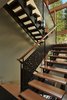 Modern home with Staircase, Wood Tread, and Metal Railing. Wood and steel stair with custom waterjet-cut steel railing panels Photo 13 of Mazama House