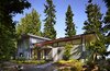 Modern home with Exterior, Metal Siding Material, Metal Roof Material, House Building Type, and Shed RoofLine. Exterior view of house on west side, showing entry walkway and front door Photo 3 of Port Ludlow House