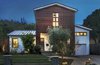 Modern home with Exterior, Farmhouse Building Type, Concrete Siding Material, A-Frame RoofLine, Green Roof Material, Metal Roof Material, Wood Siding Material, and House Building Type. Front view of ipe wood facade, standing seam metal roofing, central "factory window" Photo of Hillview House