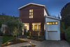 Modern home with Exterior, House Building Type, Metal Roof Material, A-Frame RoofLine, Wood Siding Material, and Concrete Siding Material. Front facade with ipe wood slat siding, standing seam metal roofing and central "factory window" Photo 2 of Hillview House