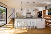 Open kitchen with island supported by reclaimed steel I-beam Photo 14 of Hillview House modern home