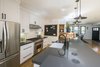 Kitchen with island, Carrara marble slab backsplash, wolf range Photo 18 of Hillview House modern home