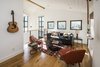 Modern home with Living Room. Loft with 2-story "factory window", tongue-and-groove ceiling, exposed beam Photo 4 of Hillview House