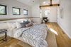 Master bedroom with built-in ledge and exposed beams Photo 5 of Hillview House modern home