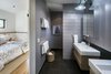 Master bath with barn door closure Photo 11 of Hillview House modern home