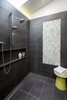 Master walk-in shower with custom glass tile section, remote controlled skylight and stainless slot drain Photo 13 of Hillview House modern home