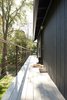 Modern home with Exterior, House Building Type, and Wood Siding Material. Walkway to the front entrance and to the deck Photo 11 of Country House With a Modern Edge