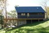 Modern home with Exterior, Wood Siding Material, A-Frame RoofLine, Shingles Roof Material, and House Building Type. The view from the pond. Photo 12 of Country House With a Modern Edge