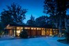 Modern home with Exterior and Mid-Century Building Type. The finely crafted cantilevered roof floats on a glass clerestory and dramatically reaches out towards the landscape. The design is organized on a rigorous eight-foot structural grid divided into living zones for both private and public spaces. Photo of Pleasant Street Residence