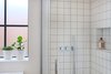 Modern home with Bath Room, Enclosed Shower, and Ceramic Tile Wall. Square matte white tiles in bathrooms Photo 7 of The Science Lab