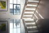 Modern home with Staircase, Wood Tread, and Metal Railing. Stainless steel kitchen worktops and new metal stairs leading to roof terrace Photo 6 of The Science Lab