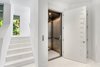 First floor contains the entry foyer with elevator services to all levels (excluding rooftop observation deck) Photo 4 of A Zen Marco Island Retreat modern home