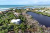 Hideaway Beach Club is a private gated community situated directly on the Gulf of Mexico with boardwalks at natural lagoons, shelling, fishing, a sports center complex, and a Gulf front Beach Club. Photo 6 of A Zen Marco Island Retreat modern home