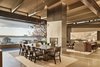 Modern home with Dining Room, Two-Sided Fireplace, Stools, Pendant Lighting, Table, Chair, Ceiling Lighting, and Concrete Floor. A neutral palette is used cohesively within the home Photo 4 of Union Bay Residence
