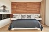 Modern home with Light Hardwood Floor. The master bedroom features a wall of teak paneling Photo 13 of Union Bay Residence