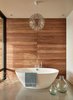 Modern home with Concrete Floor and Pendant Lighting. A Moooi chandelier hangs above the soaking tub Photo 15 of Union Bay Residence