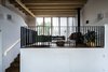 Modern home with Living Room, Wood Burning Fireplace, Dark Hardwood Floor, Ceiling Lighting, and Sofa. lounge hang out Photo 13 of Woodland house