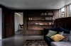 Modern home with Living Room, Ceiling Lighting, Sofa, Recessed Lighting, Concrete Floor, and Bookcase. Simple yet beautiful DIY shelves made from leather and mahogany with hidden LED strips Photo 4 of Woodland house