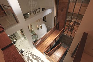 A double-height entrance atrium welcomes visitors into this multi-generational family home in Agra, India, in a project designed by the New Delhi design firm of flyYingseeds Studio. The different parts of the existing home were reshuffled, bringing together a large family.