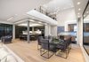 Modern home with Dining Room, Table, Ceiling Lighting, Gas Burning Fireplace, Chair, Pendant Lighting, Storage, Accent Lighting, and Light Hardwood Floor. Dining & Kitchen Photo 14 of Oxford Residence