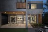 Modern home with Exterior, Metal Siding Material, Wood Siding Material, House, Stucco Siding Material, and Flat RoofLine. Rear Yard - Covered Patio Photo 8 of Oxford Residence