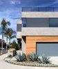 Modern home with Exterior, House, Stucco Siding Material, Wood Siding Material, Flat RoofLine, and Metal Siding Material. Front View Photo of Oxford Residence