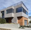 Modern home with Exterior, House, Flat RoofLine, Wood Siding Material, Metal Siding Material, and Stucco Siding Material. Front Corner View Photo 2 of Oxford Residence