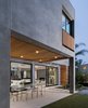Modern home with Exterior, House, Stucco Siding Material, Flat RoofLine, and Wood Siding Material. Rear Yard - Covered Patio Photo 3 of Oxford Residence