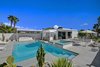 Modern home with Outdoor, Salt Water Pools, Tubs, Shower, Hardscapes, Concrete Fences, Wall, Gardens, Concrete Patio, Porch, Deck, Horizontal Fences, Wall, Trees, Back Yard, Hot Tub Pools, Tubs, Shower, Shower Pools, Tubs, Shower, Concrete Pools, Tubs, Shower, Landscape Lighting, Swimming Pools, Tubs, Shower, Metal Fences, Wall, Boulders, Large Patio, Porch, Deck, and Large Pools, Tubs, Shower. Facing east from pool and spa to outdoor kitchen and house. Photo of Donald Wexler's Steel House #4 in Palm Springs