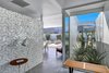 Modern home with Hallway and Concrete Floor. Walls of glass as you enter the home. Photo 2 of Donald Wexler's Steel House #4 in Palm Springs