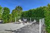 Modern home with Outdoor, Shrubs, Trees, and Side Yard. Outdoor conversation room with firepit and butterfly chairs just off the bedroom patio. Photo 7 of Donald Wexler's Steel House #4 in Palm Springs