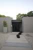 Modern home with Exterior, House Building Type, Brick Siding Material, Shingles Roof Material, and Mid-Century Building Type. front door of the house Photo 9 of Grey House