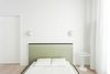 Modern home with Bedroom, Night Stands, Wardrobe, Medium Hardwood Floor, Ceiling Lighting, Bed, and Wall Lighting. Meta Side Table by New Tendency | Hat lamp by Louis Poulsen | view from bedroom Photo 8 of A-PLACE by Thisispaper Studio