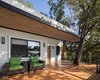 Modern home with Outdoor, Front Yard, Trees, Small Pools, Tubs, Shower, Decking Patio, Porch, Deck, and Landscape Lighting. Balcony with tree insert Photo 2 of Casa de la Tierra y el Mar