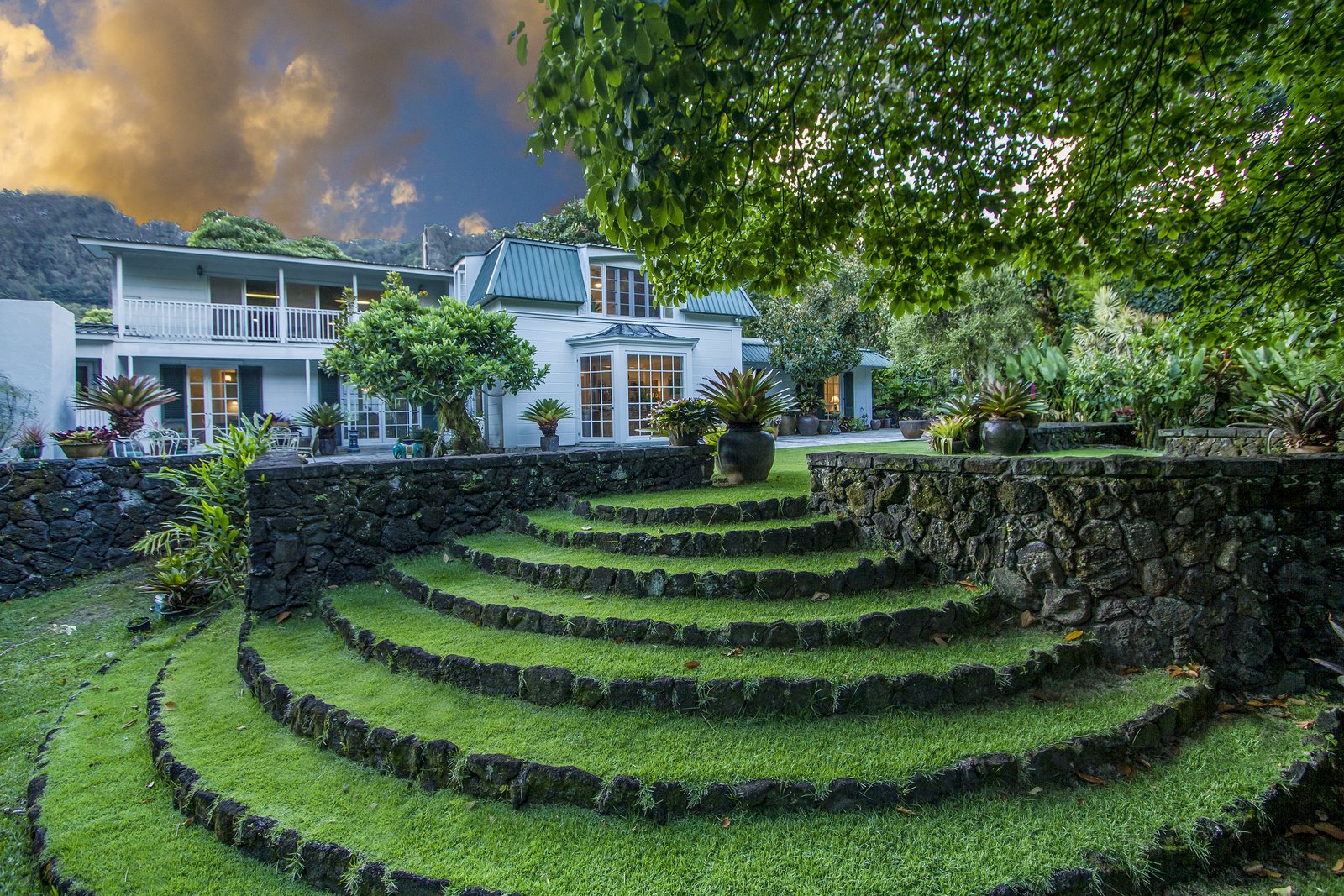 The backyard lava rock walls and grand staircase