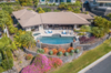 Modern home with Outdoor, Large Pools, Tubs, Shower, Hardscapes, Stone Patio, Porch, Deck, Shrubs, Large Patio, Porch, Deck, Swimming Pools, Tubs, Shower, Boulders, Landscape Lighting, Slope, Gardens, Stone Fences, Wall, Infinity Pools, Tubs, Shower, Horizontal Fences, Wall, Retaining Fences, Wall, and Back Yard. Thoughtful design continues outside of the entire site plan. Photo of Hawaii Architect's Home in Keauhou Estates