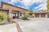 Modern home with Outdoor, Hanging Lighting, Front Yard, Stone Patio, Porch, Deck, Concrete Patio, Porch, Deck, Walkways, Shrubs, and Landscape Lighting. Beautiful entrance with custom leaded glass welcomes you home. Photo 2 of Hawaii Architect's Home in Keauhou Estates