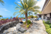 Modern home with Outdoor, Pavers Patio, Porch, Deck, Large Pools, Tubs, Shower, Trees, Side Yard, Stone Fences, Wall, Horizontal Fences, Wall, Large Patio, Porch, Deck, Landscape Lighting, Stone Patio, Porch, Deck, Planters Patio, Porch, Deck, Retaining Fences, Wall, Shrubs, and Infinity Pools, Tubs, Shower. Access to the swim up bar. Photo 15 of Hawaii Architect's Home in Keauhou Estates