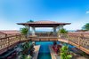 Lounge area and deck above the pool's cascading waterfall is perfect for taking in the view of Lanai and Kaho'olawe. Photo 3 of Launiupoko Luxury Estate modern home
