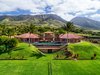Commanding view of the home and tennis court. Photo of Launiupoko Luxury Estate modern home