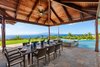 Modern home with Dining Room, Ceiling Lighting, Table, Slate Floor, and Chair. Breathtaking view from the outdoor dining area. Photo 8 of Launiupoko Luxury Estate